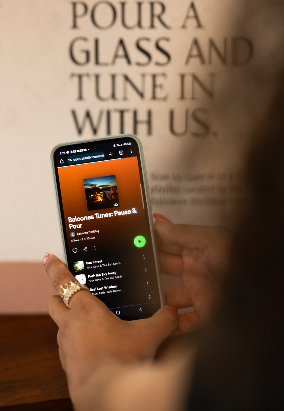 Phone showing Balcones Tunes: Pause & Pour Playlist of Spotify