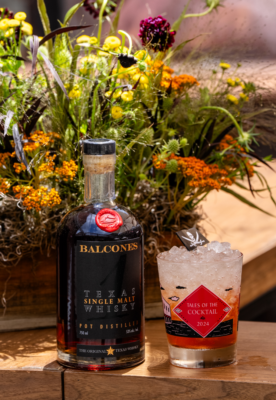 Bottle of Texas 1 American Single Malt Whisky with Cocktail in custom Tales of the Cocktail glass